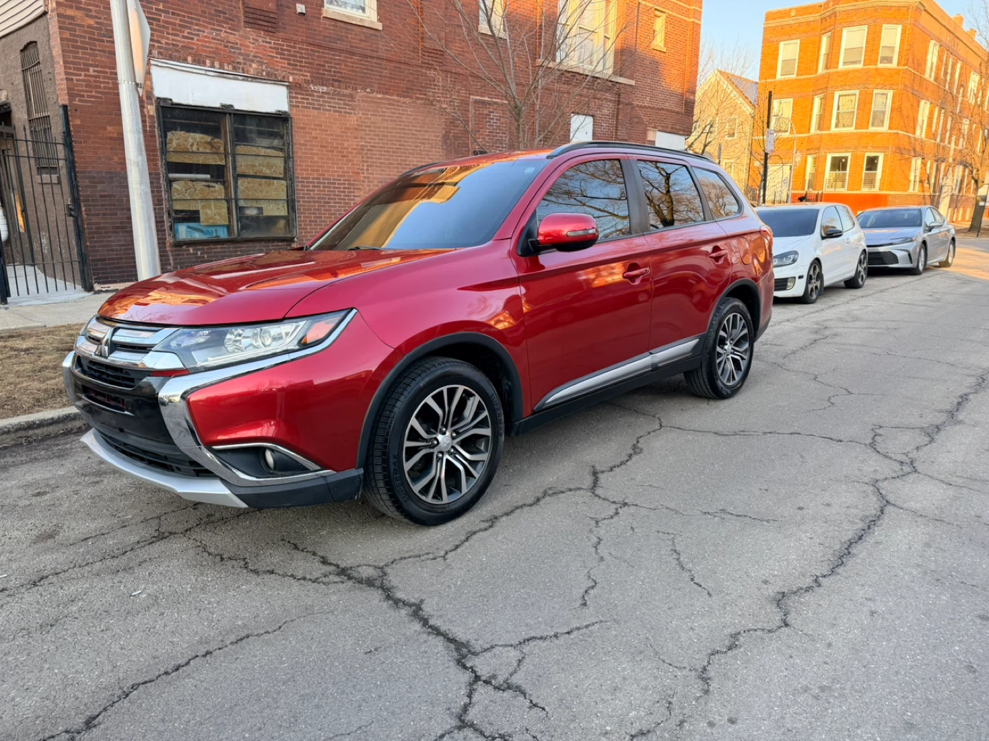Red Mitsubishi Outlander SUV