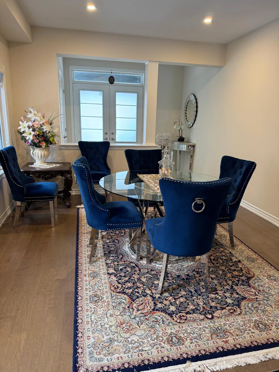 Round Glass Top Dining Table with 4 Blue Velvet Chairs