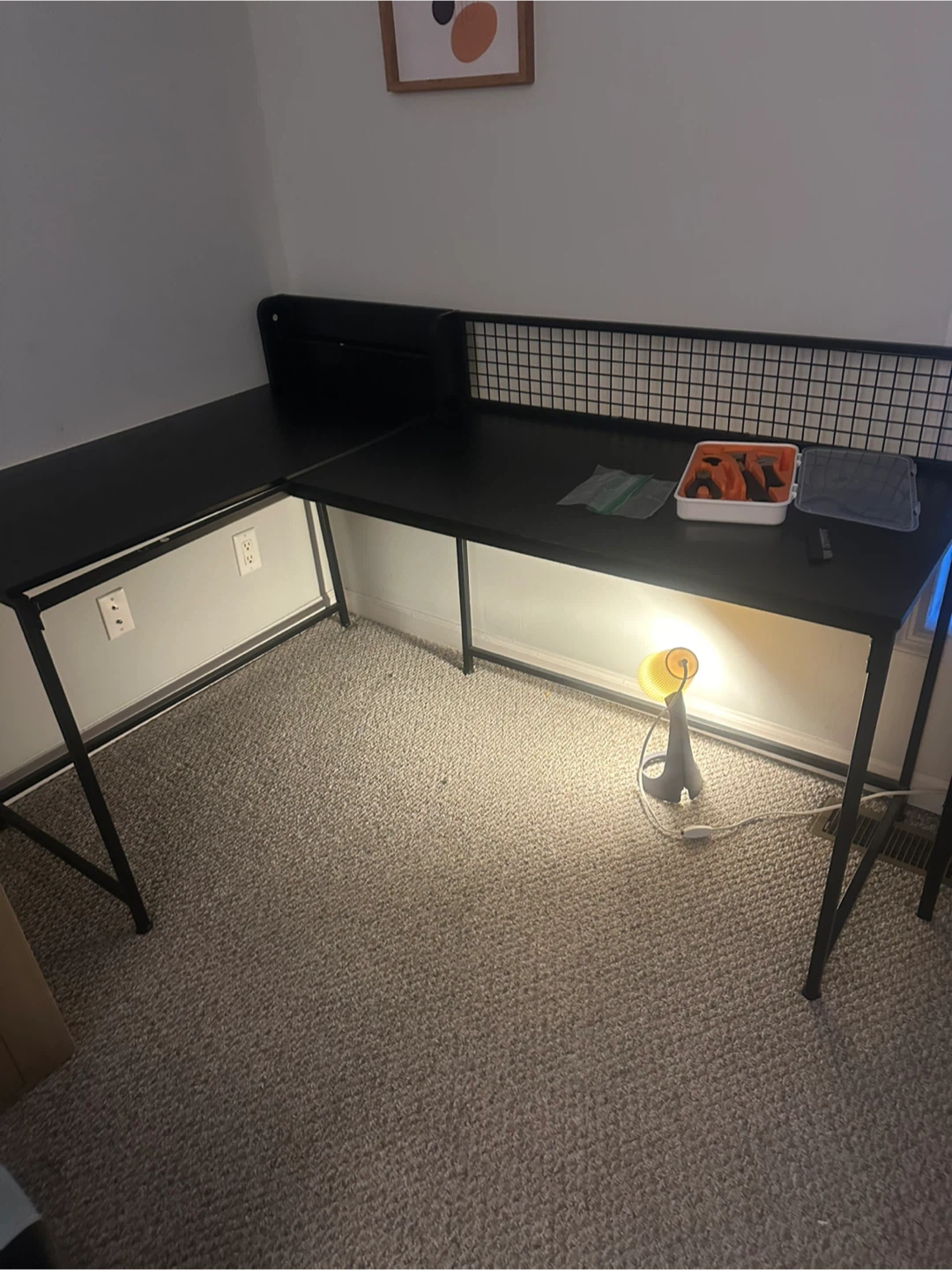 Black L-Shaped Desk with Metal Mesh Backing