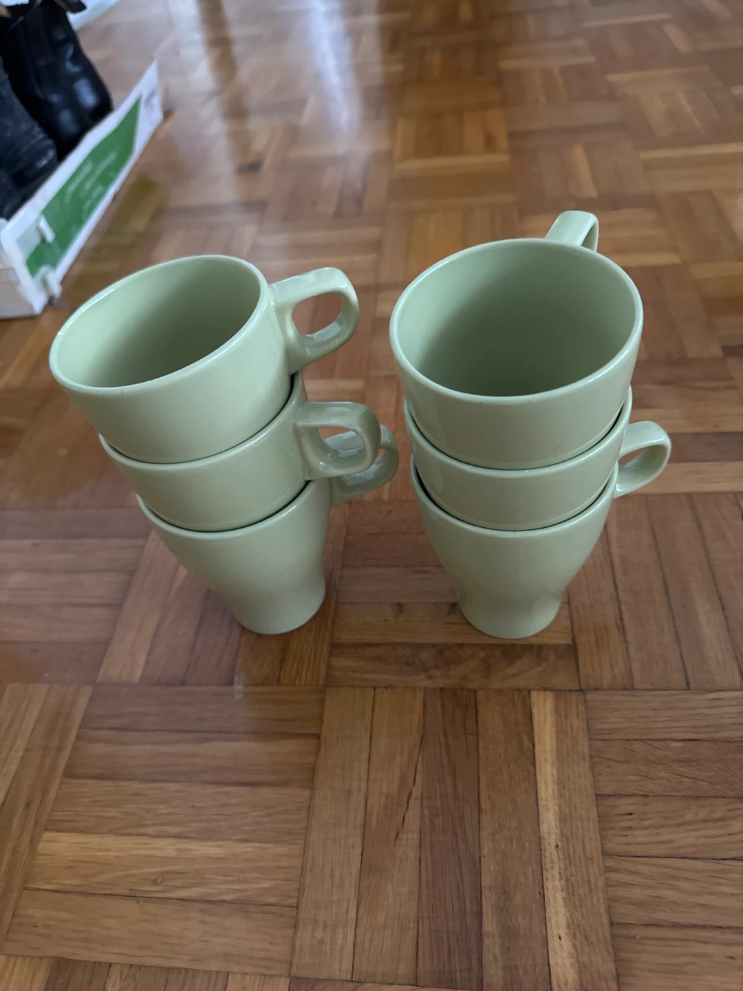 Set of six light green mugs