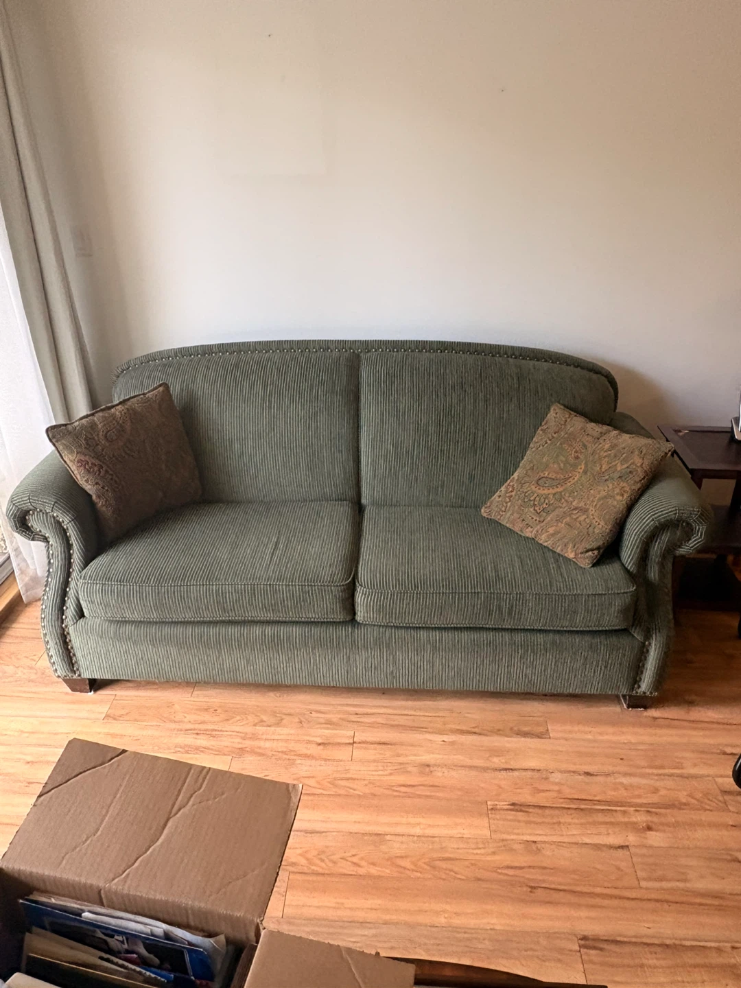 Green Corduroy Sofa with Decorative Pillows