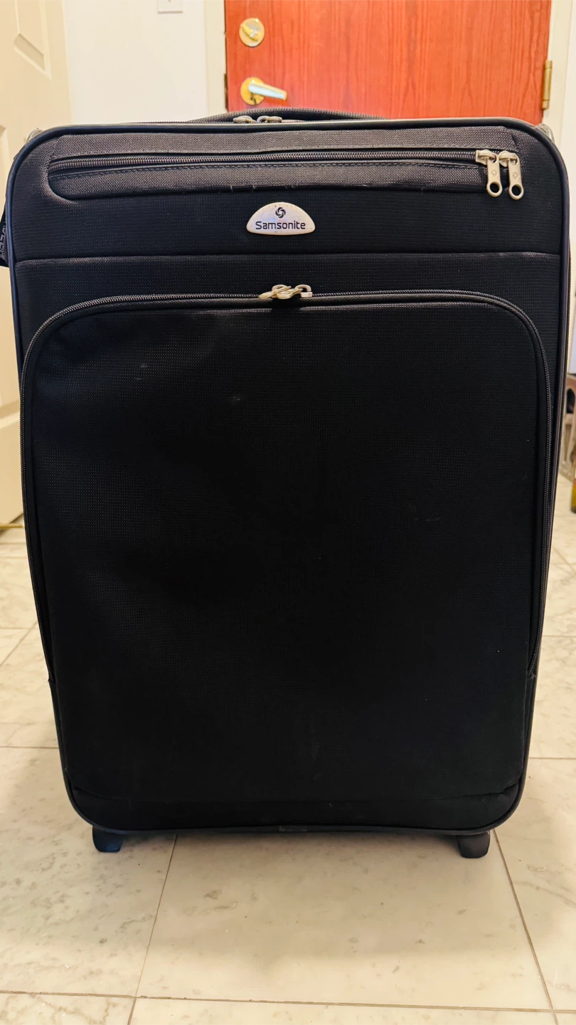 Samsonite 26” expandable Black Rolling Suitcase