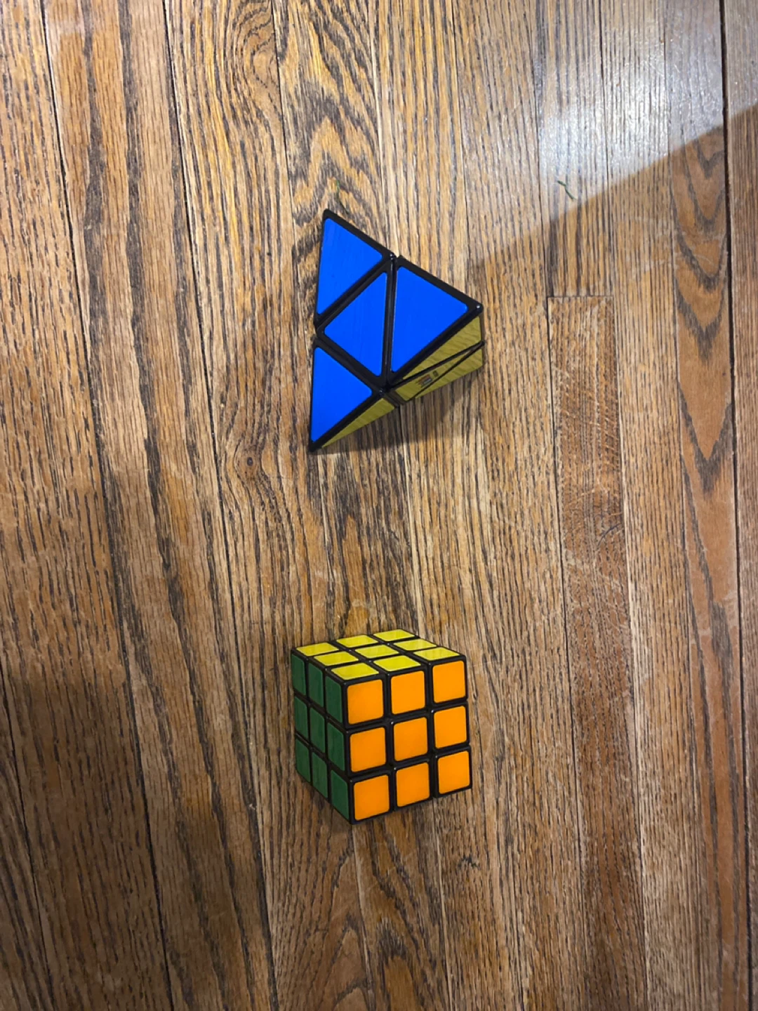 2 Puzzles: Rubik's Cube and Triangular Prism Puzzle