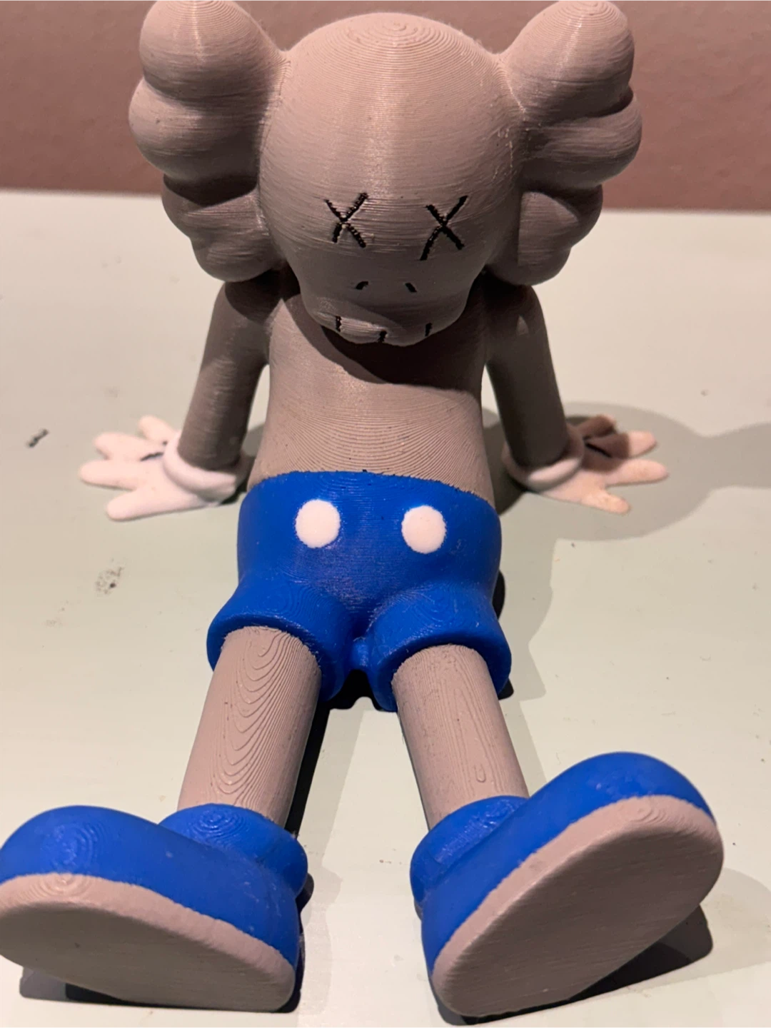 KAWS 3D printed phone and book holder