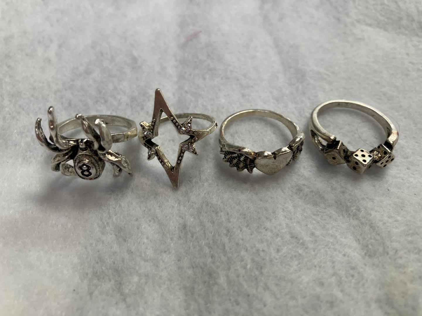 Set of 4 Silver Tone Rings - Spider, Star, Heart, Dice Designs