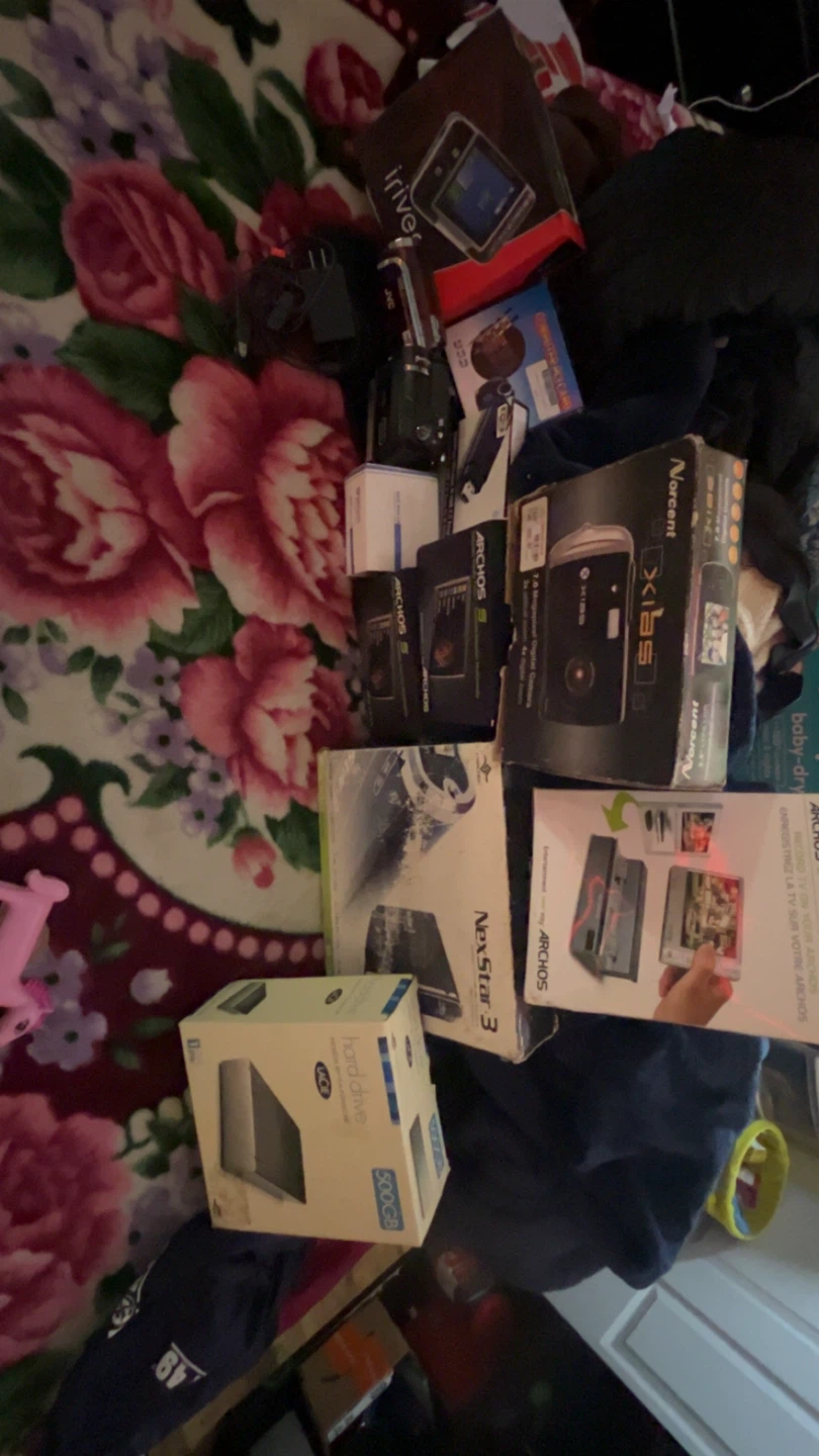 box of electronics for computer, cameras, hard drives