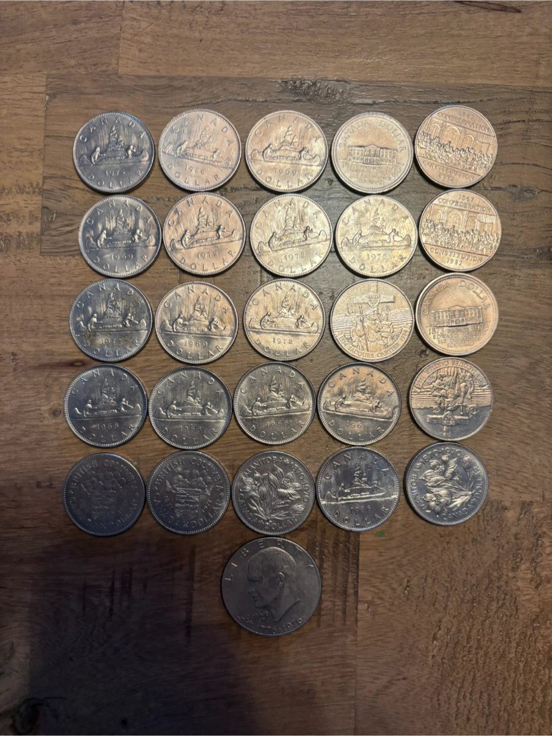 25 Canadian Dollar Coins (1968–1986) + Eisenhower Dollar