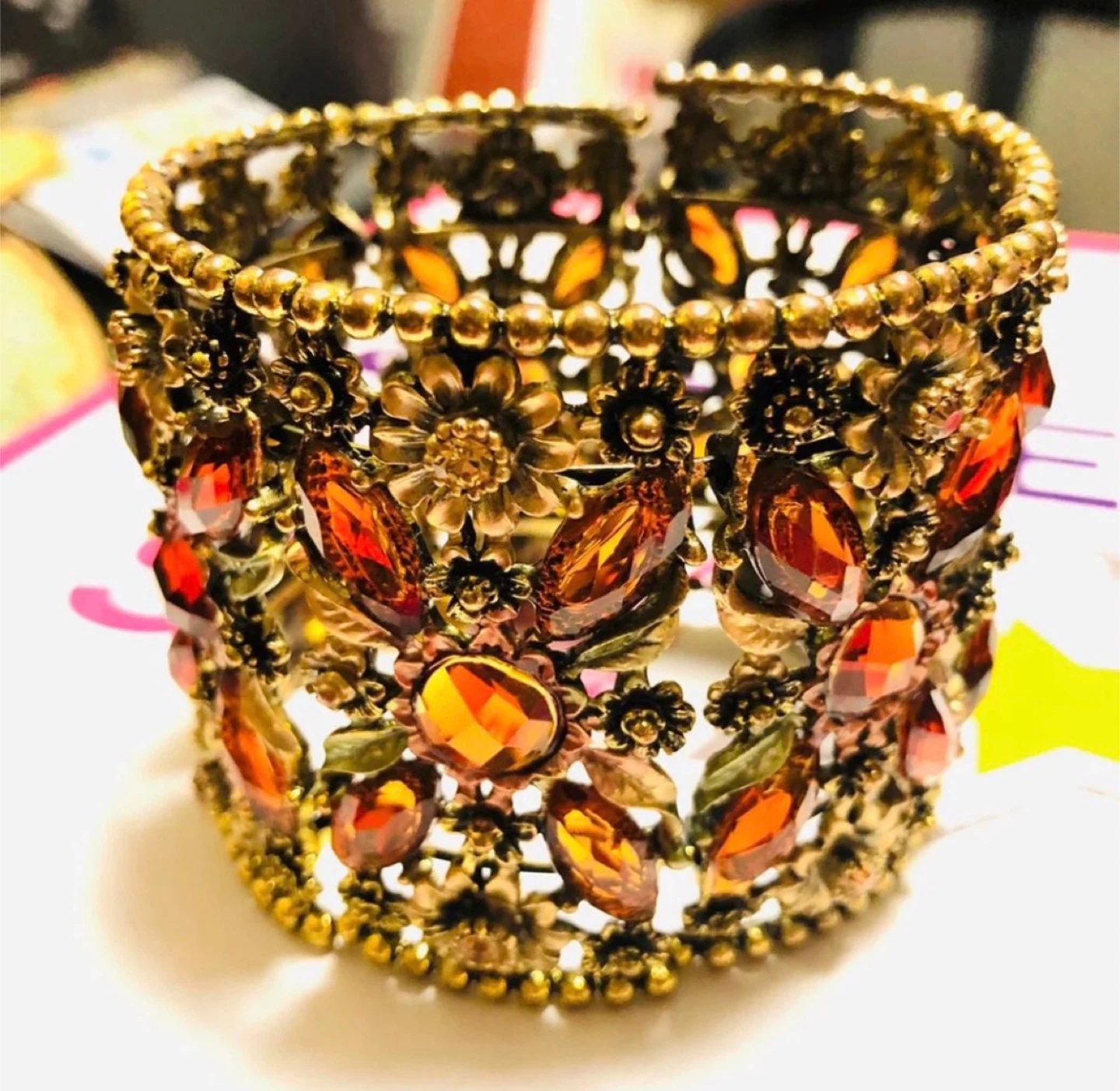 Ornate Gold-Tone Bangle Bracelet with Amber Gems