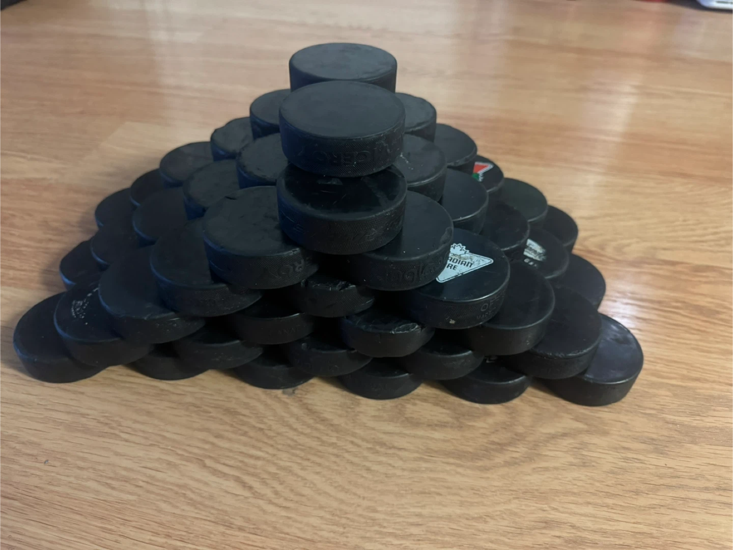 65 Used Hockey Pucks