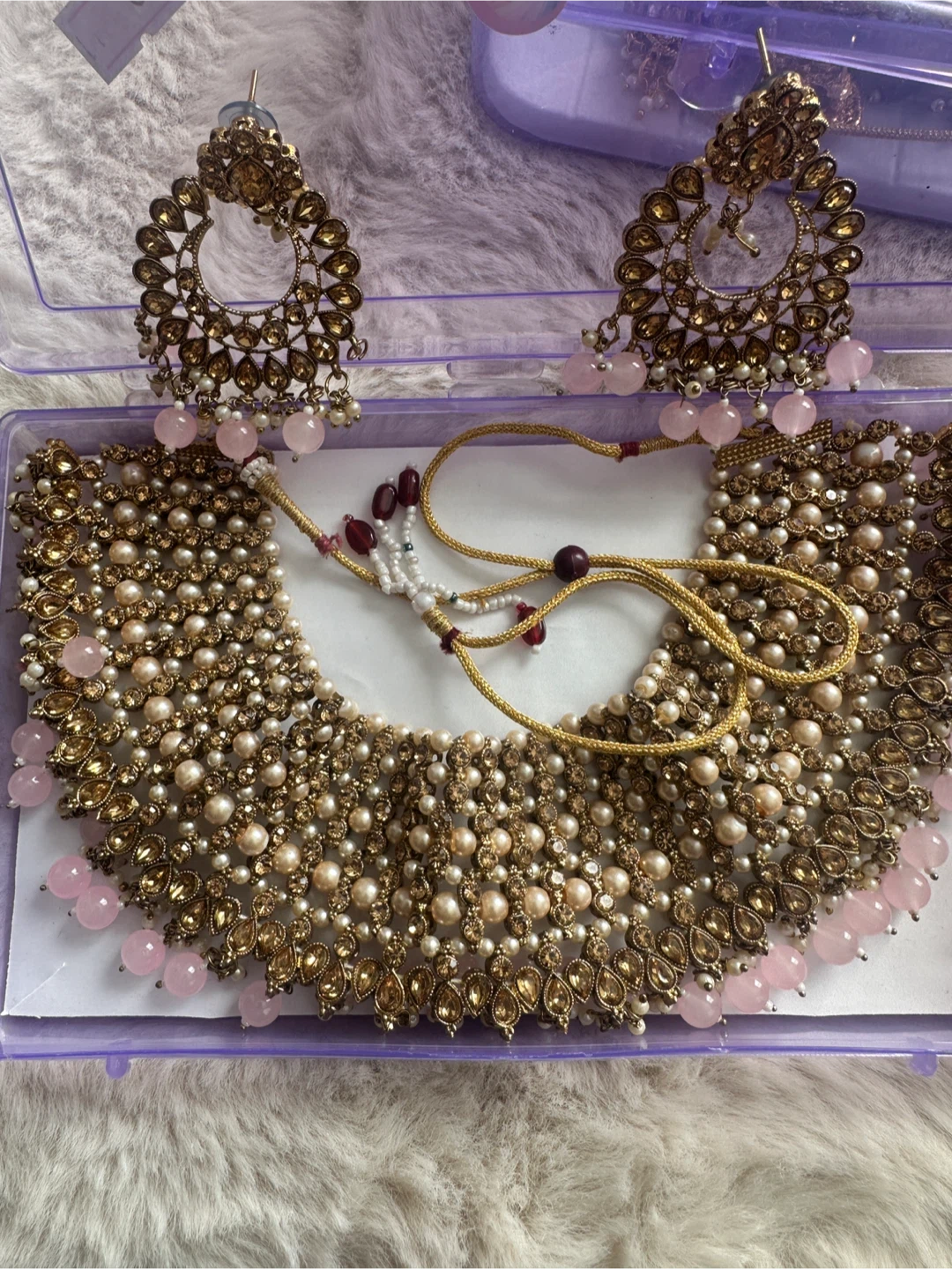 Gold-tone statement necklace and earrings set with pink beads