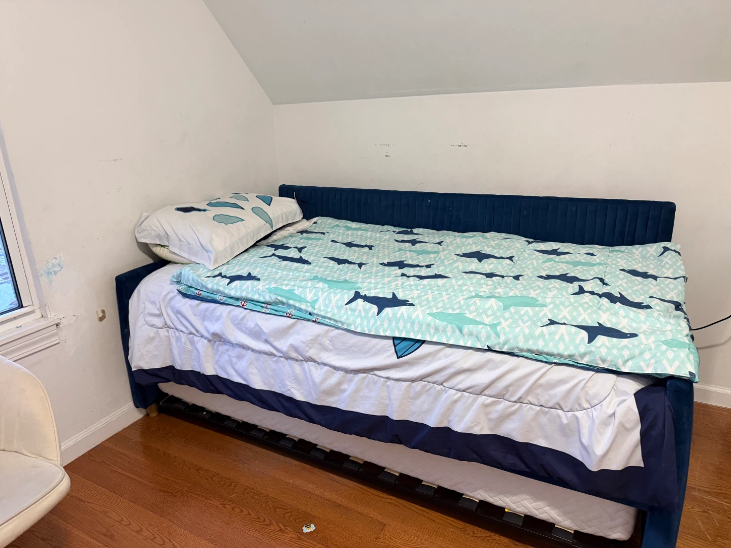 Blue Upholstered Daybed with Shark-Themed Bedding