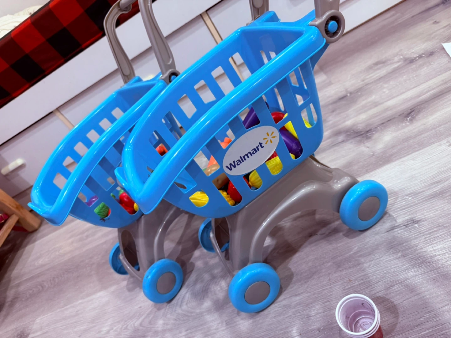 Two Blue Toy Shopping Carts with Play Food