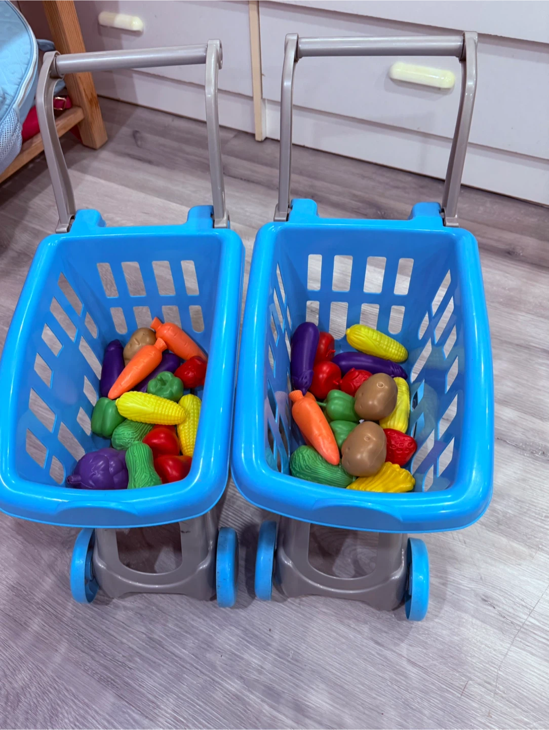 Two Blue Toy Shopping Carts with Play Food - photo 4