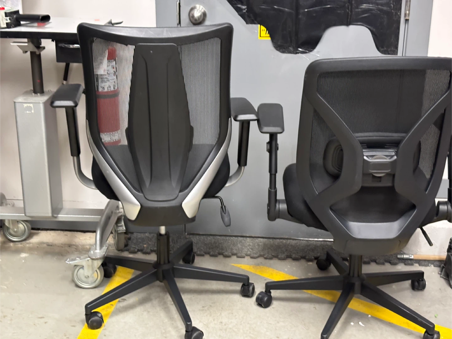 Two Black Mesh Office Chairs