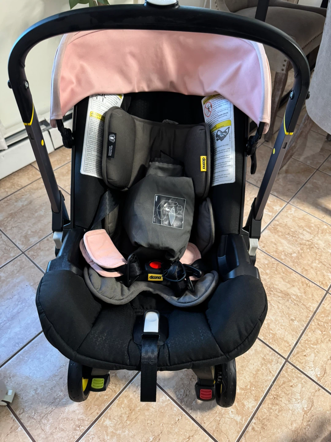 Doona Infant Car Seat and Stroller - Black with Pink Canopy
