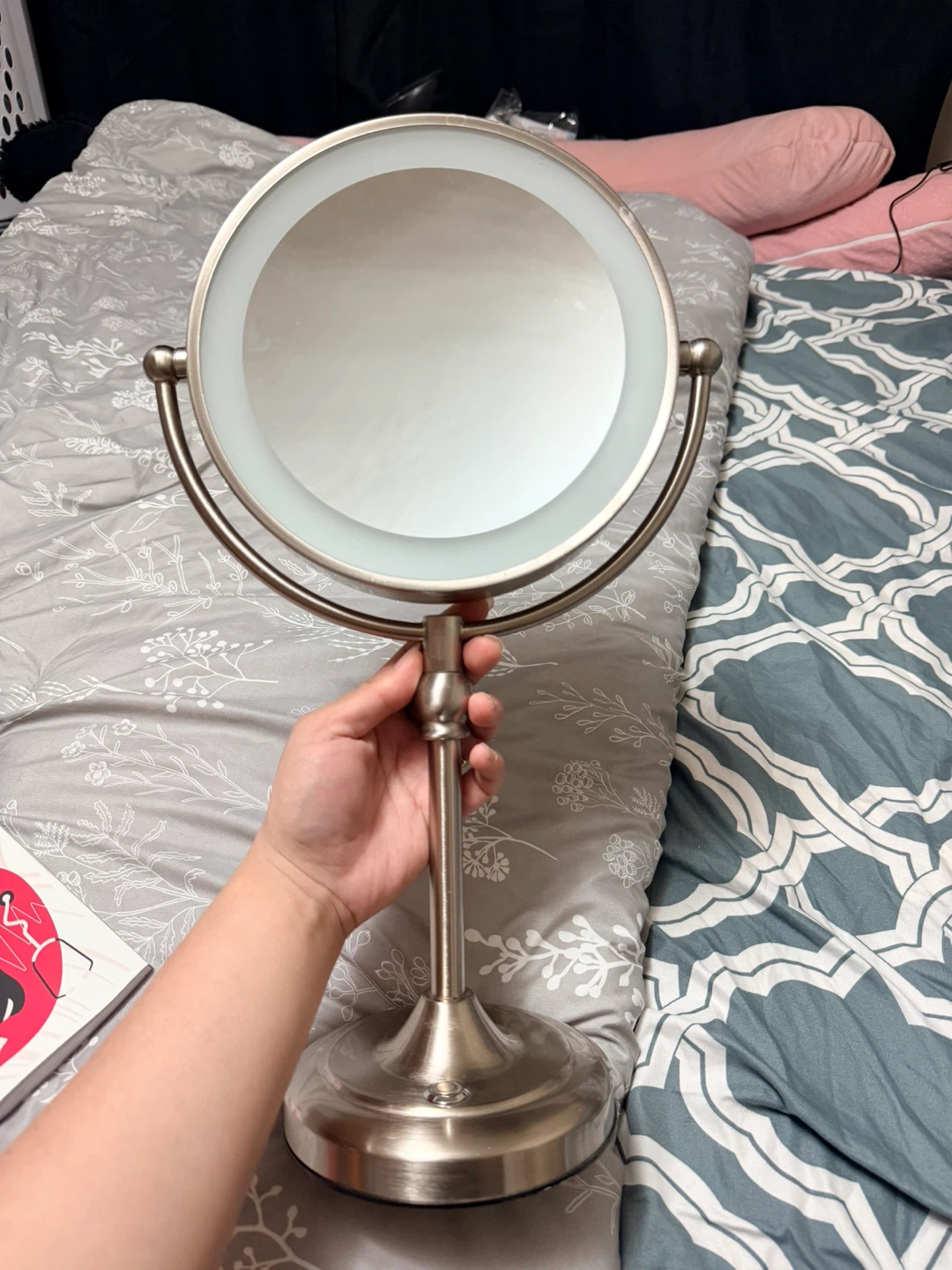 Two-sided vanity mirror