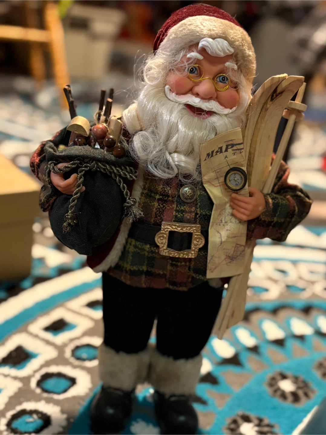 Santa Claus figure with skis and map