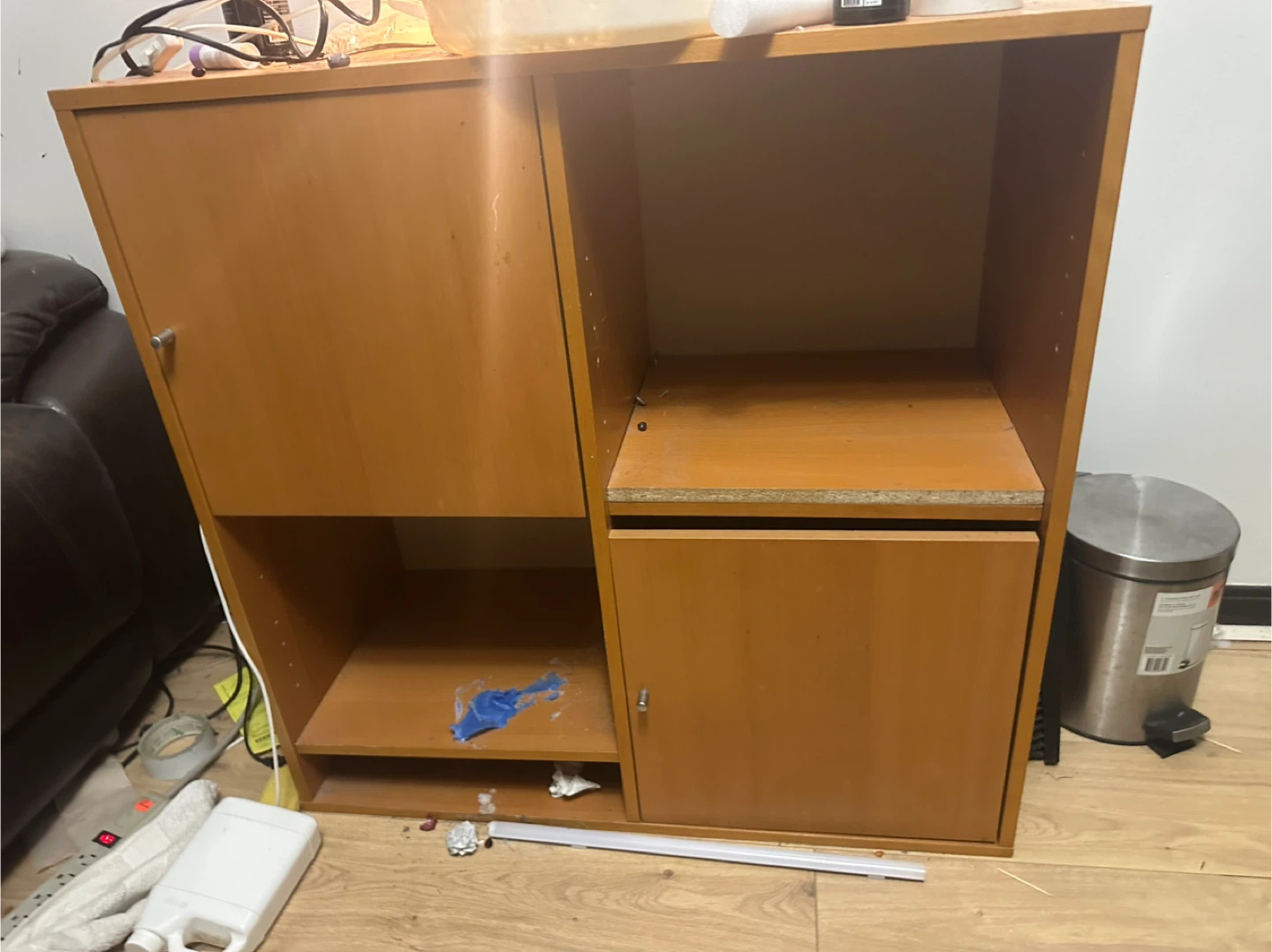 Wooden storage cabinet with door and shelves