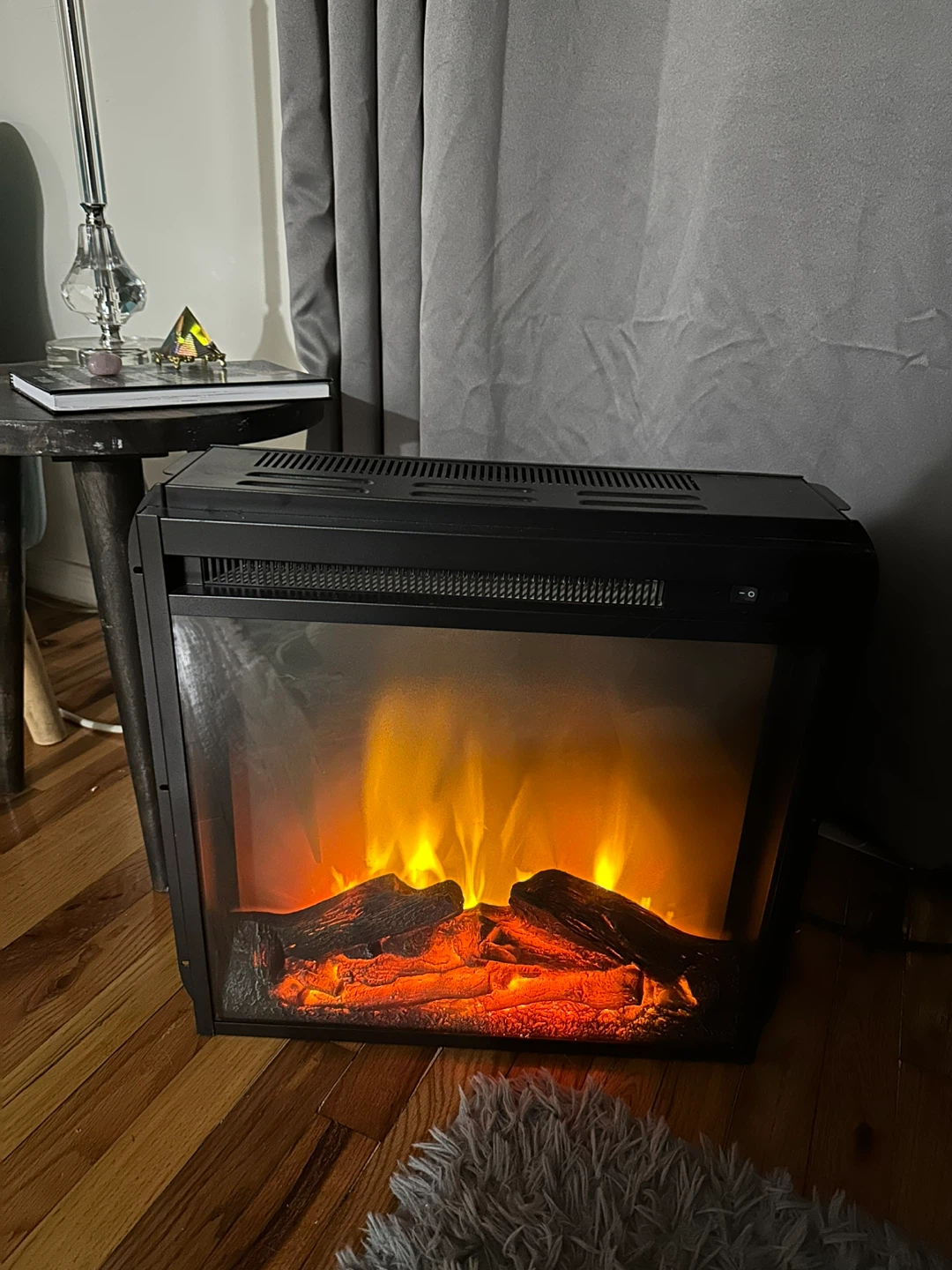 Black Electric Fireplace with Realistic Flame Effect