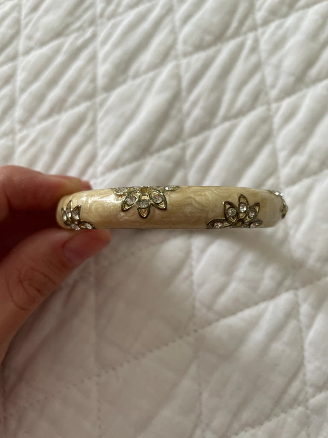 Cream and gold bangle with rhinestone flowers