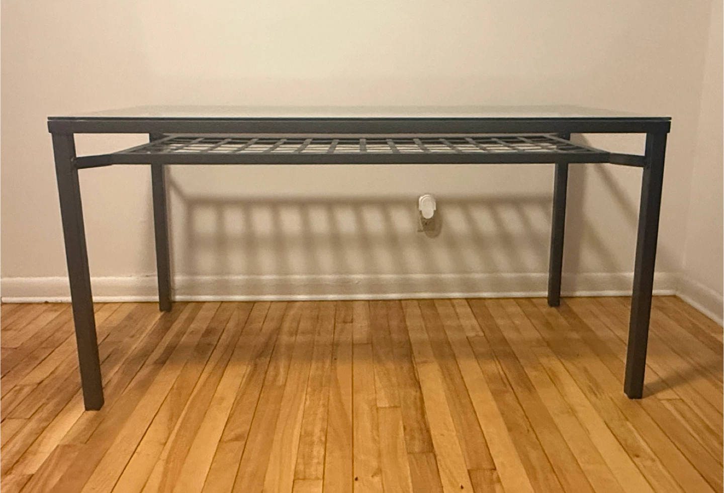 ($50) Black metal dining table with a glass top