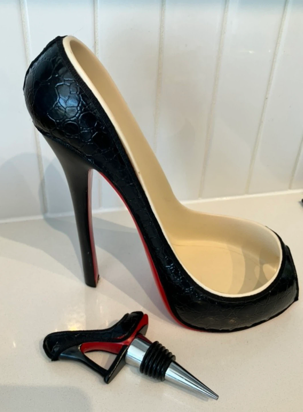 Fun red bottom wine holder with stopper