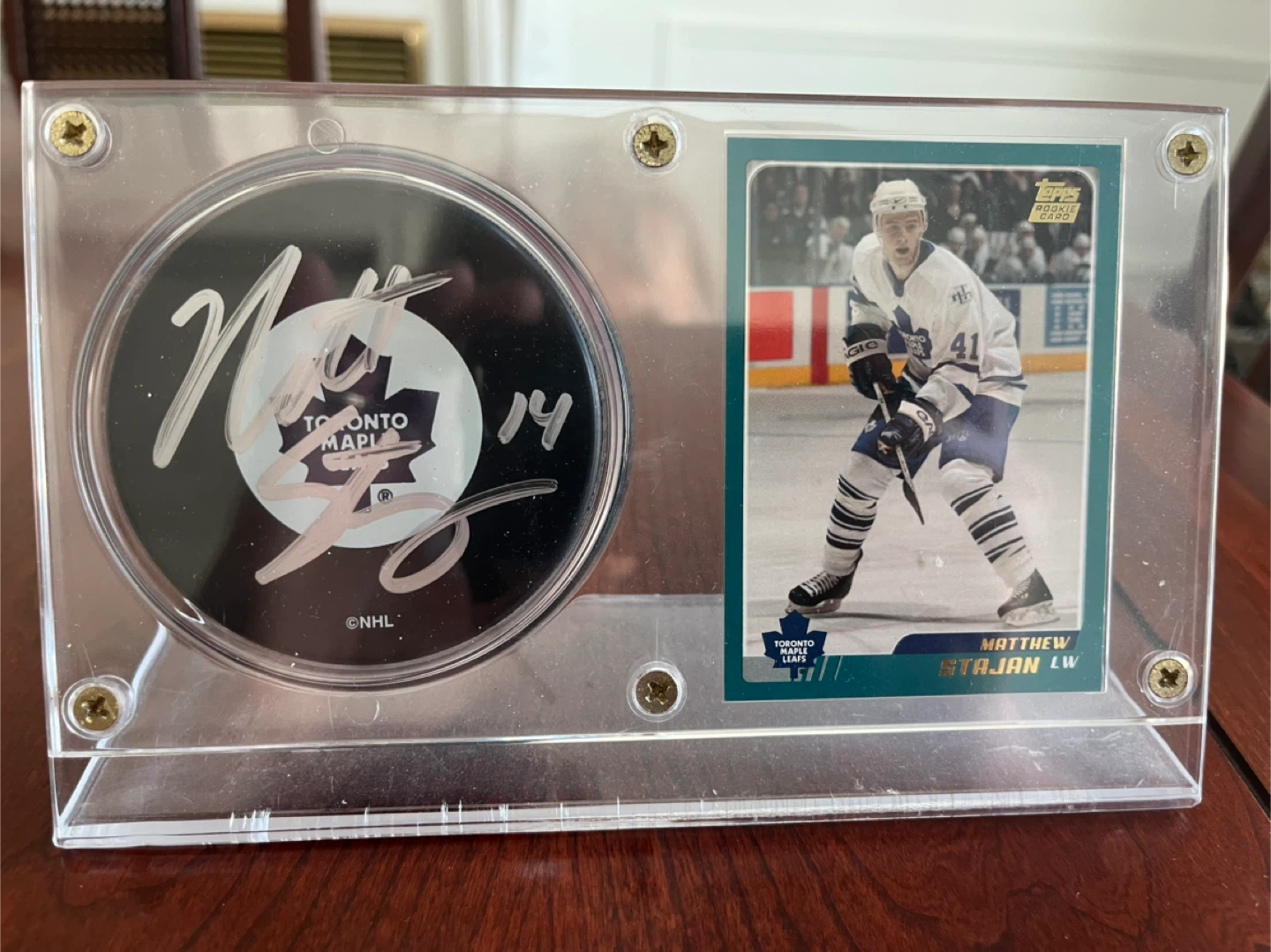 Matthew Stajan autographed puck, stand and hockey card