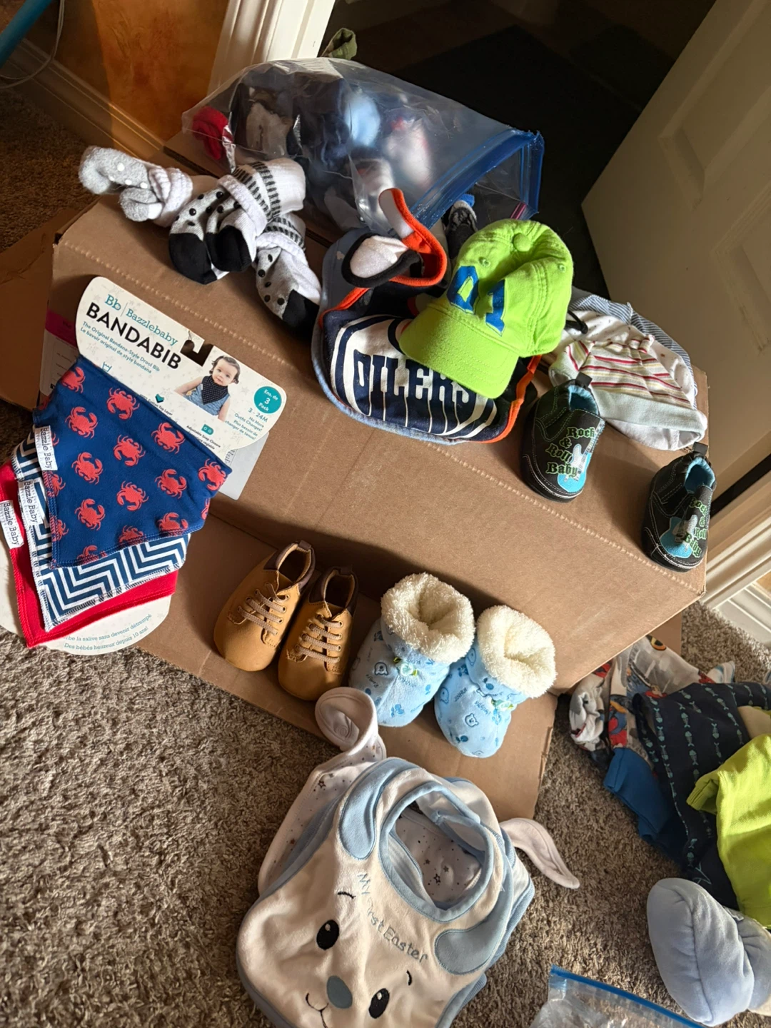 Box of Baby’s bibs, shoes, socks, hats, slippers and more