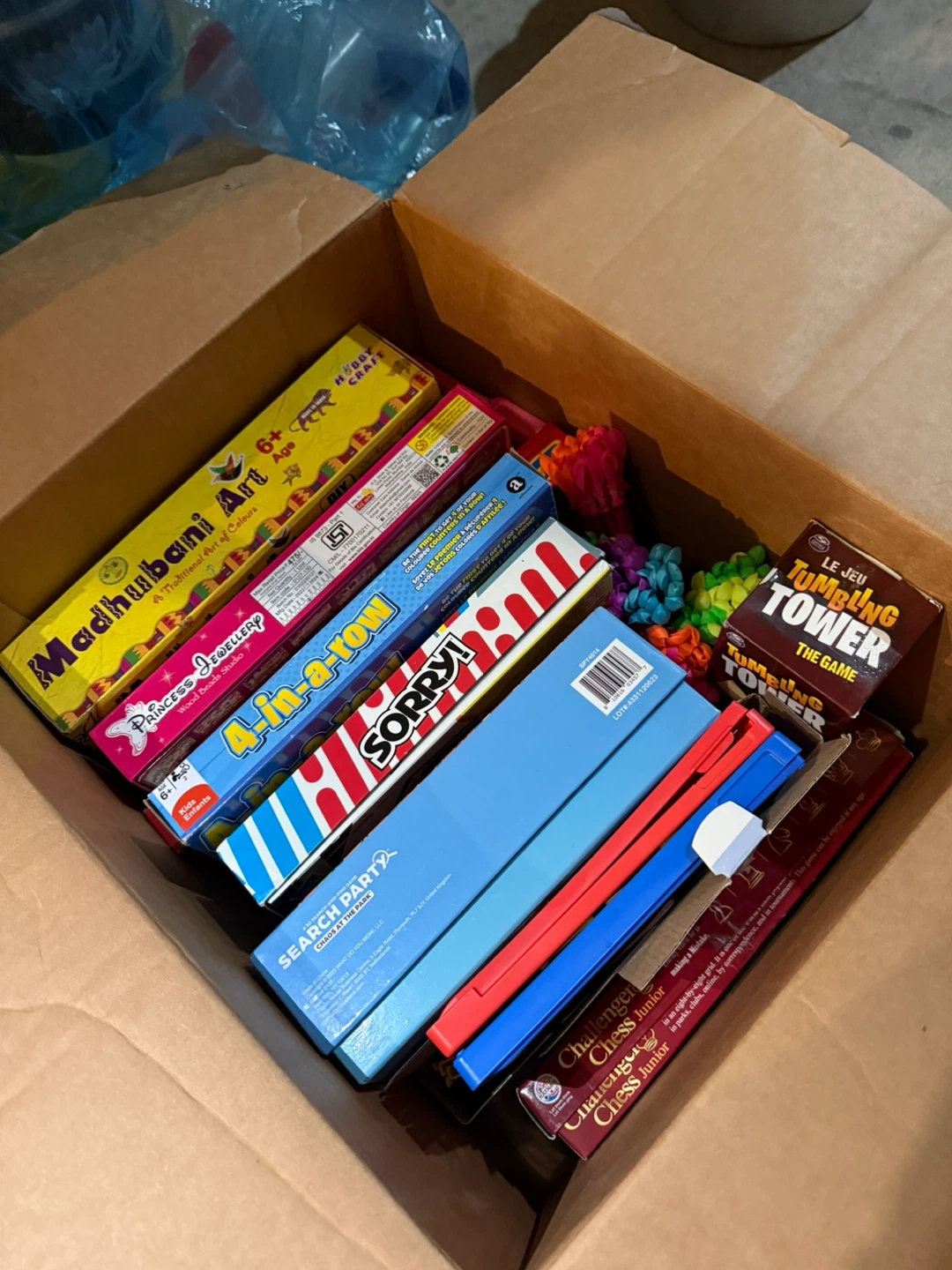 Collection of Board Games and Art Supplies