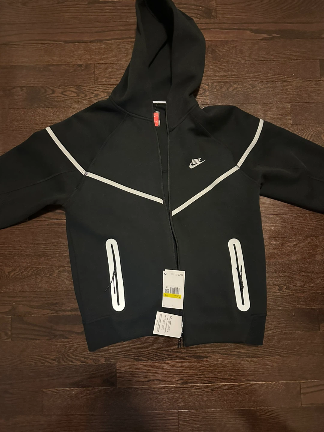 Reflective black and white Nike tech fleece
