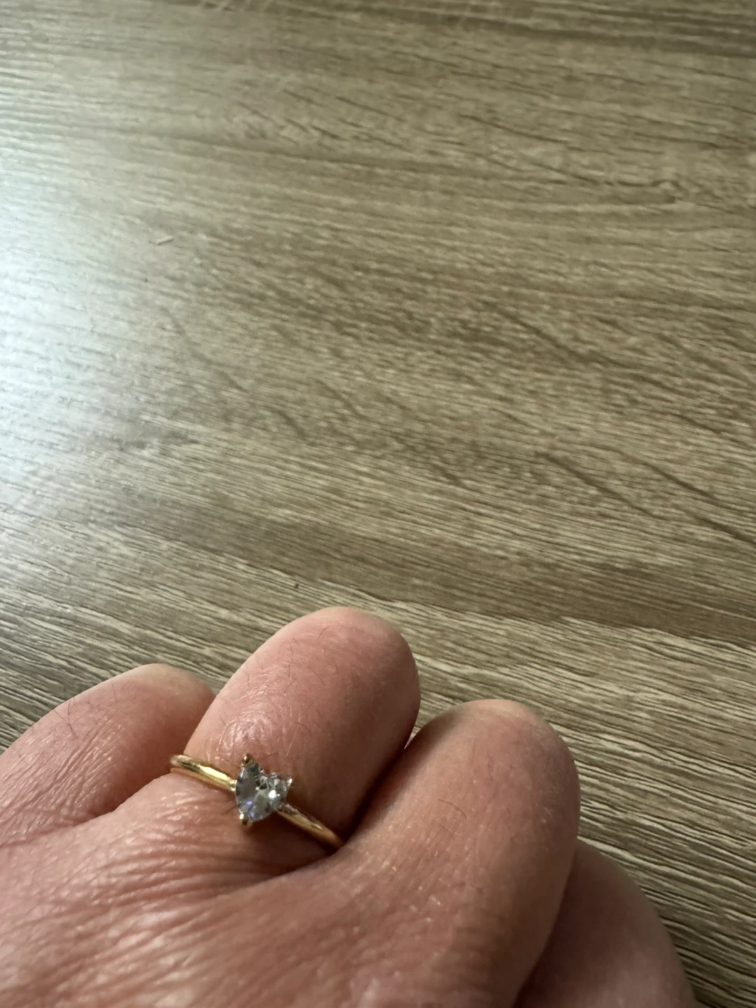 Gold-tone ring with a clear stone size 9