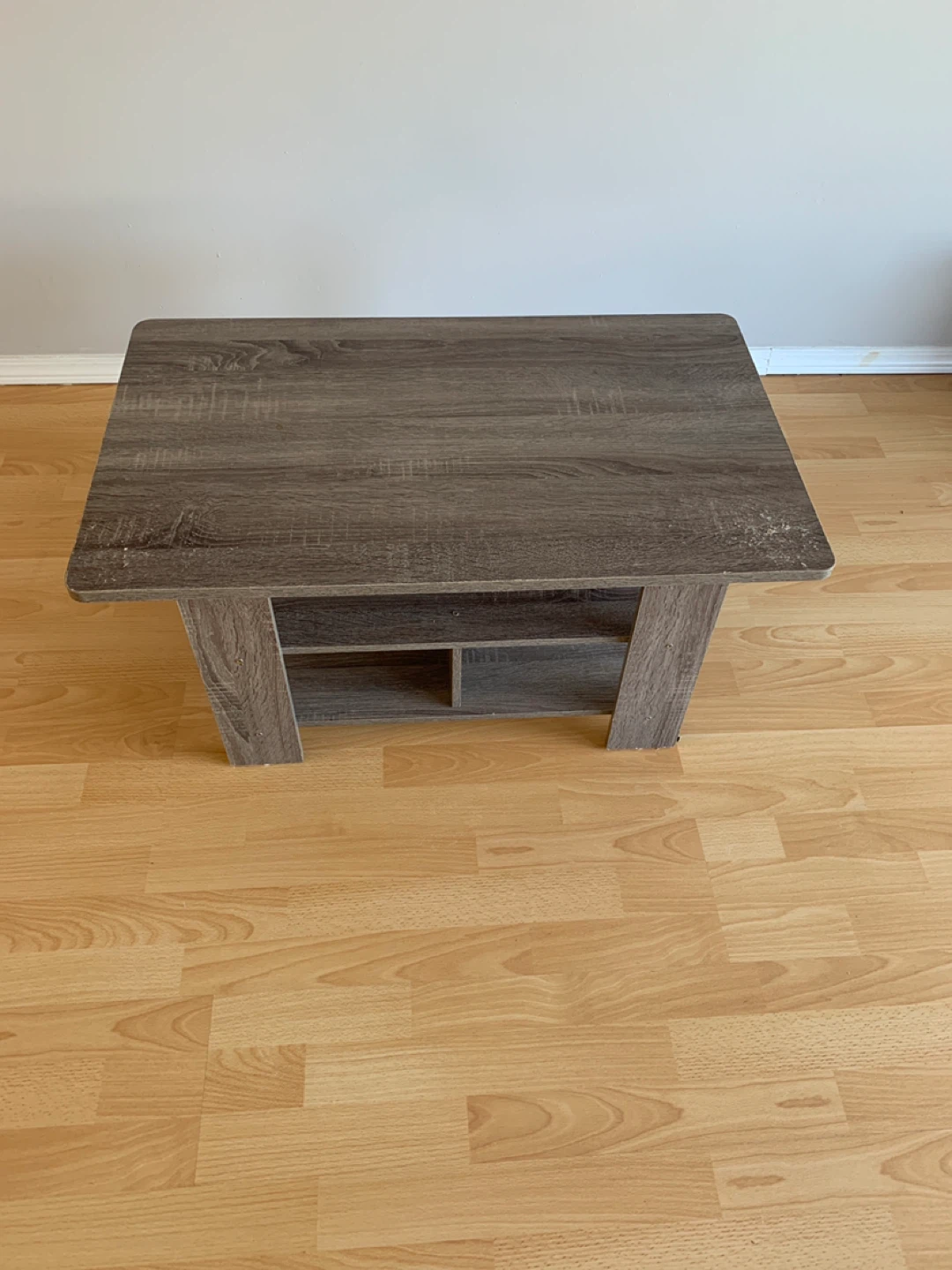 Wood grain coffee table with shelf
