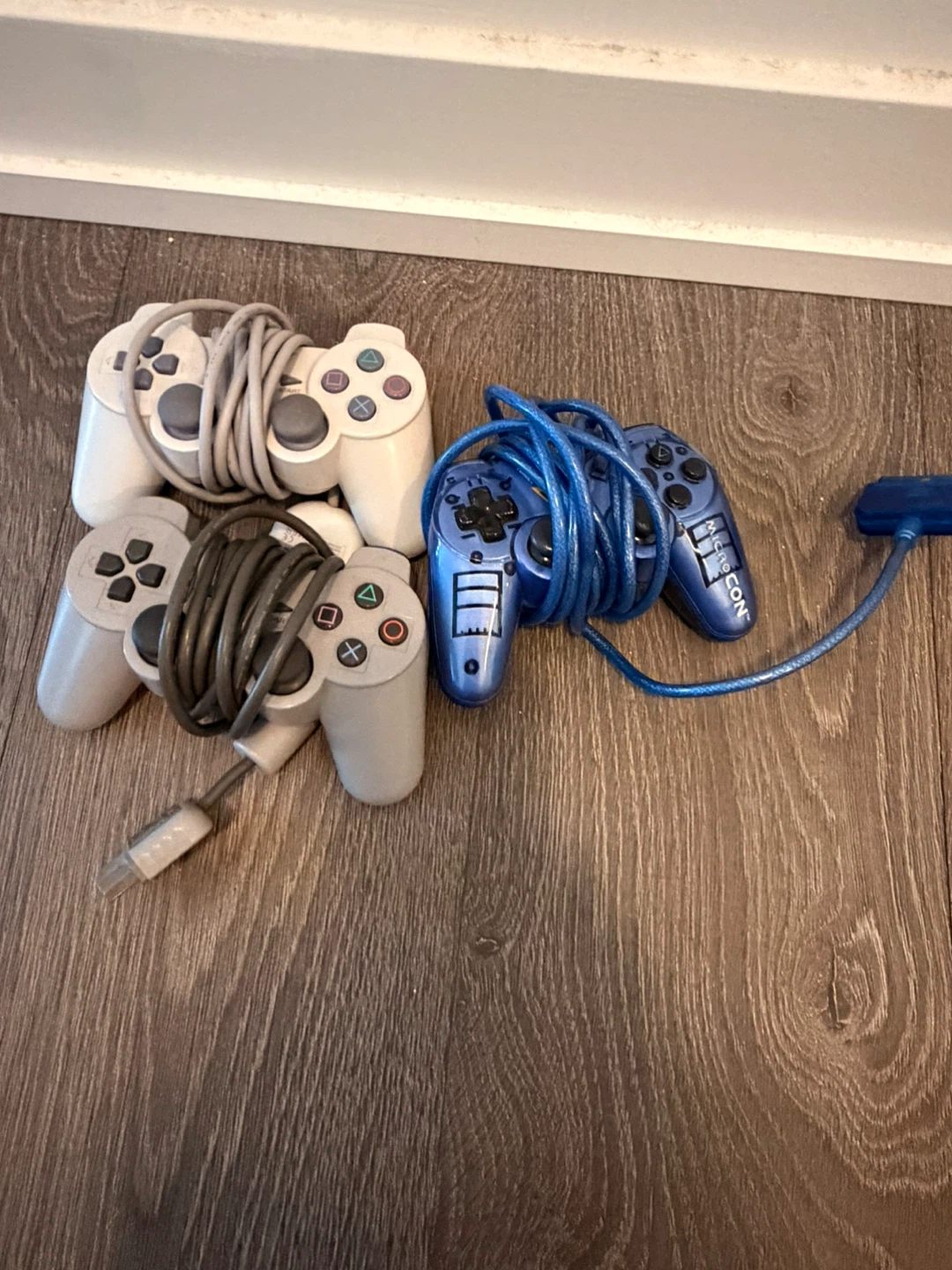PlayStation Controllers (3x Grey, 1x Blue)
