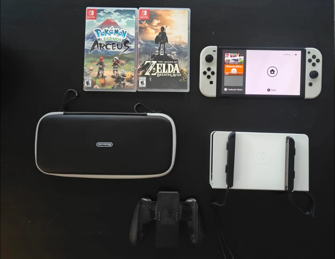 Nintendo Switch OLED with 2 games and accessories
