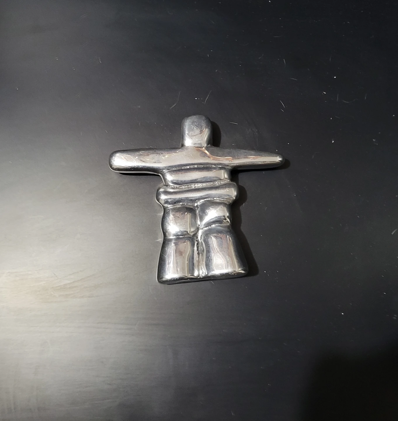 Sleek Chrome Inukshuk Statue - Meaningful Inuit-