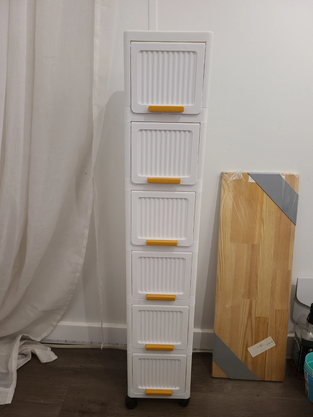 Tall, slim, plastic storage cabinet
