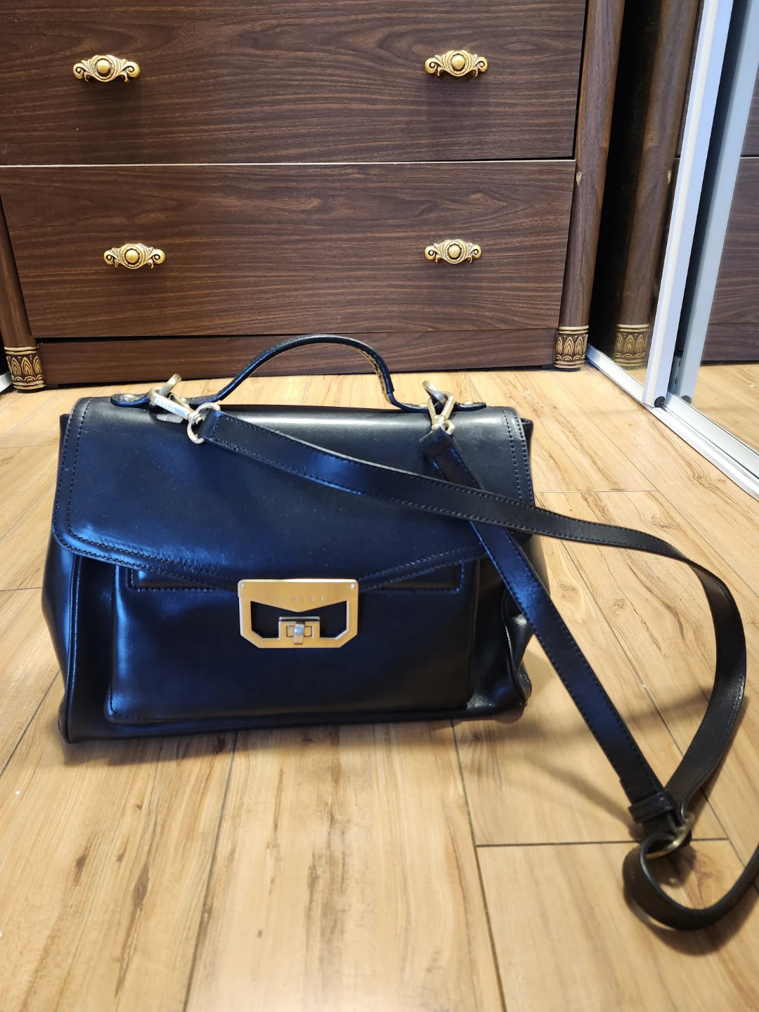 Black Leather Handbag with Gold Accents