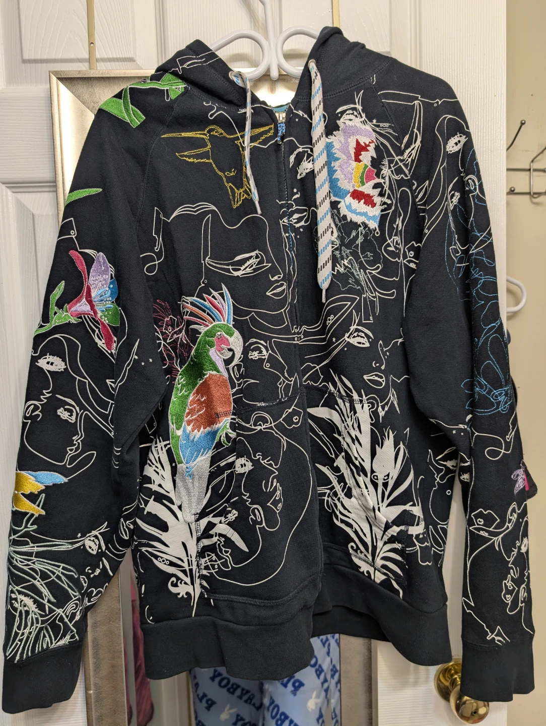 Artful Dodger Black Med Hoodie with Abstract Faces and Parrots