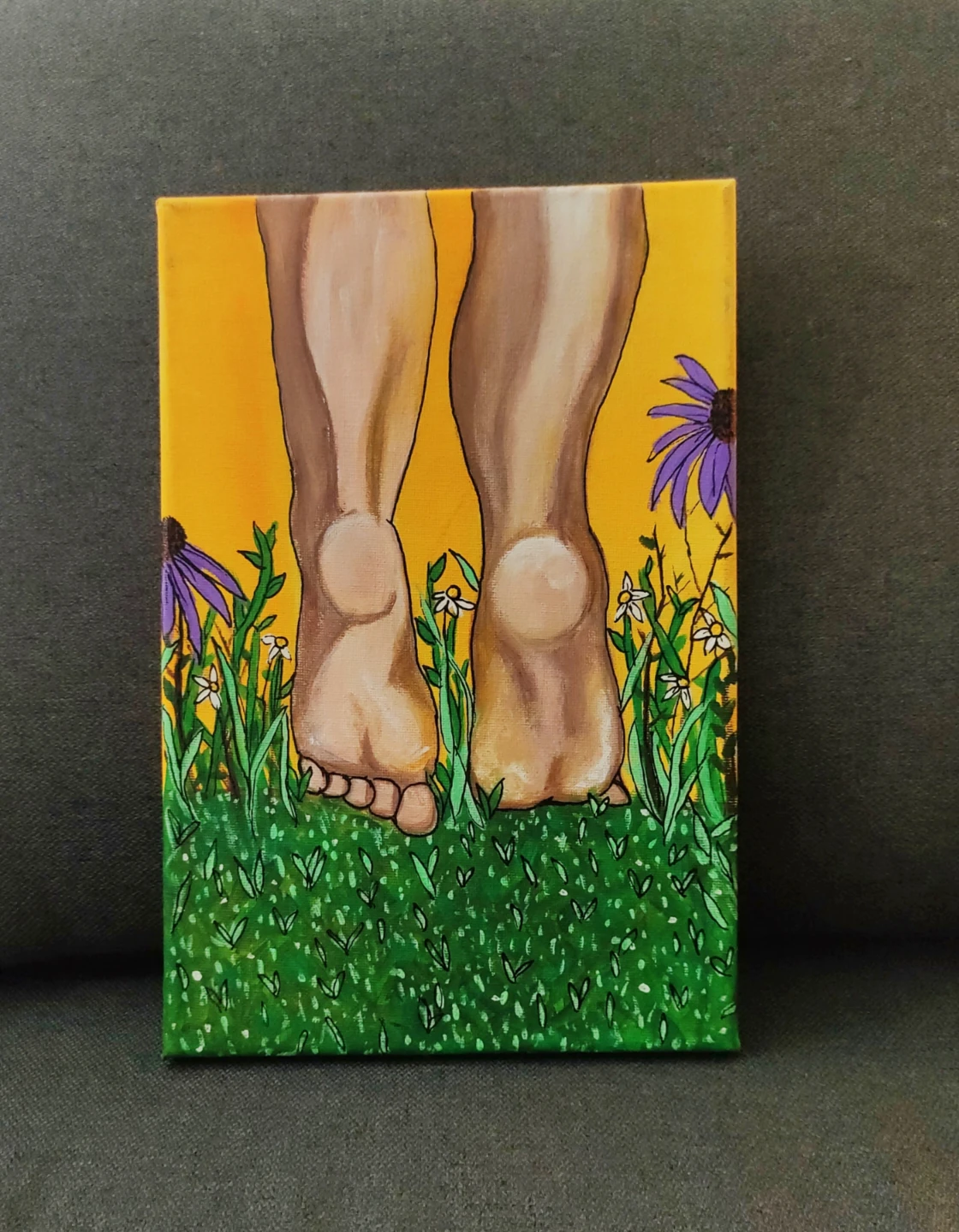 Canvas painting of feet walking in grass