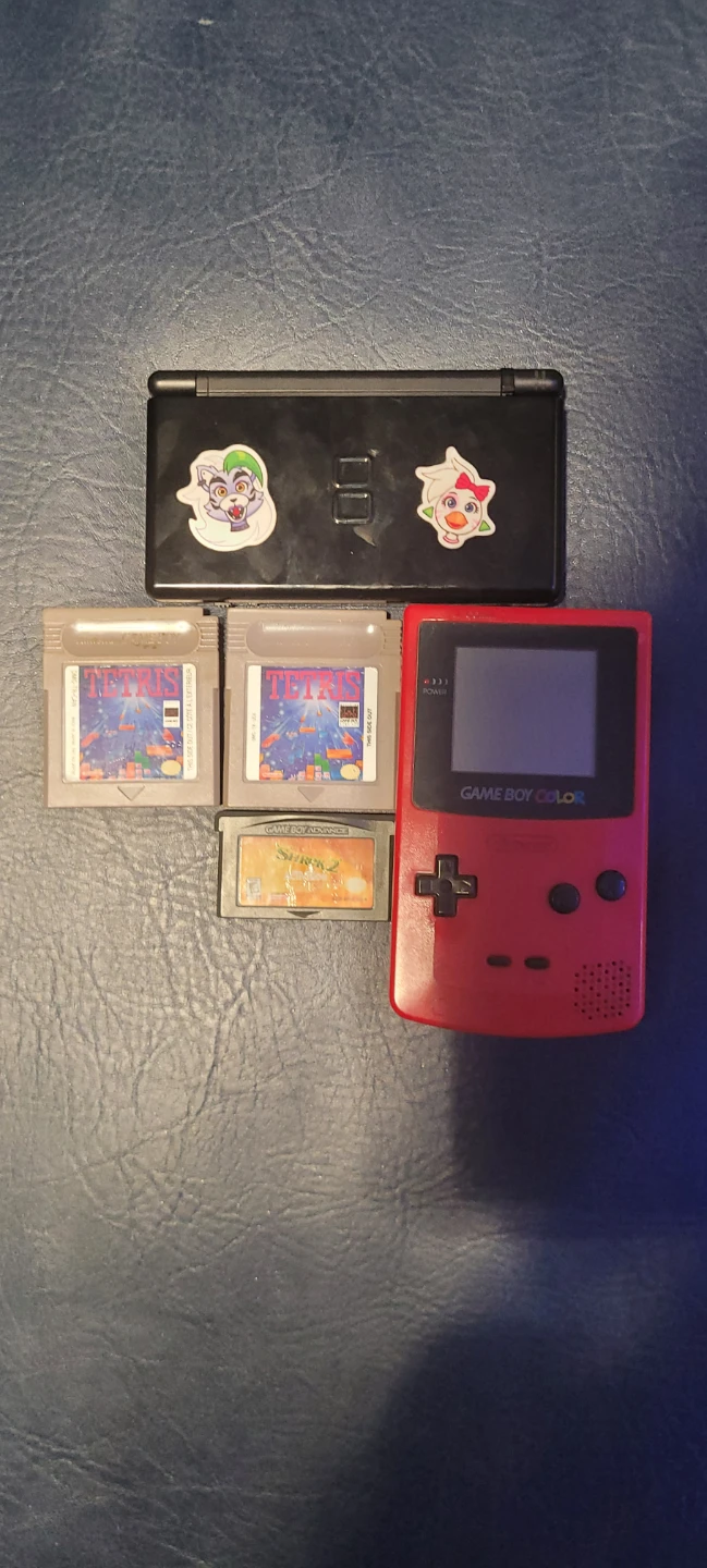 Nintendo Game Boy Color Red and a 3ds with Tetris and Shrek 2