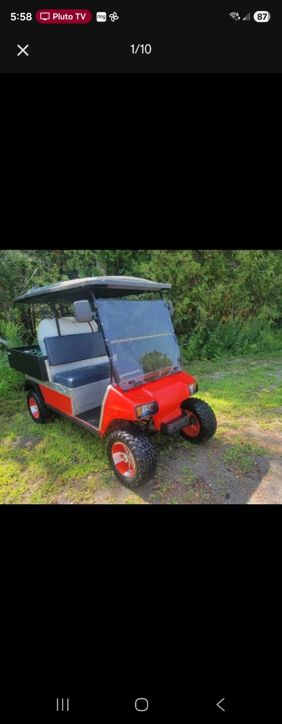 Red Golf Cart with Utility Box