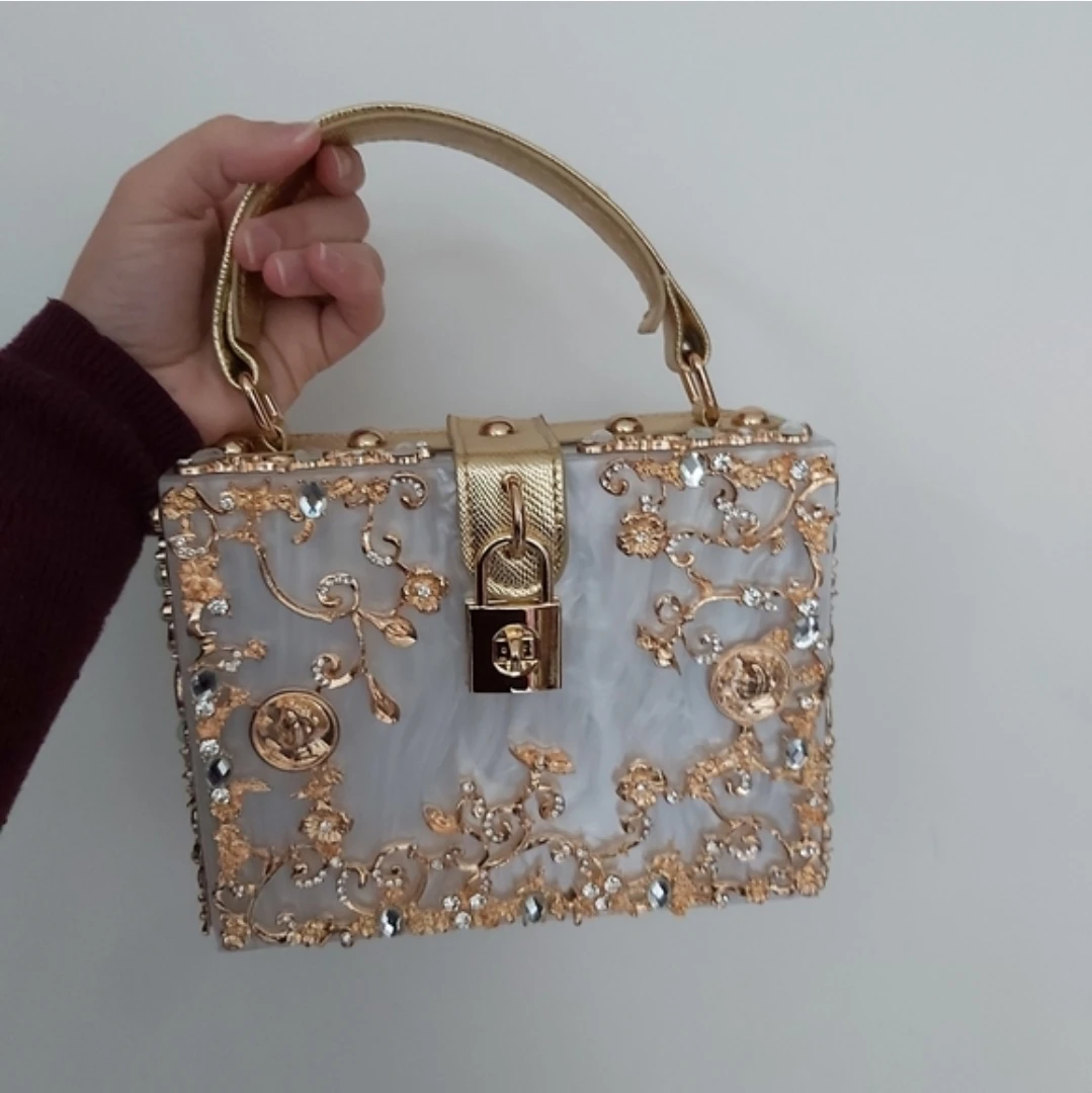 Acrylic and gold plated handbag