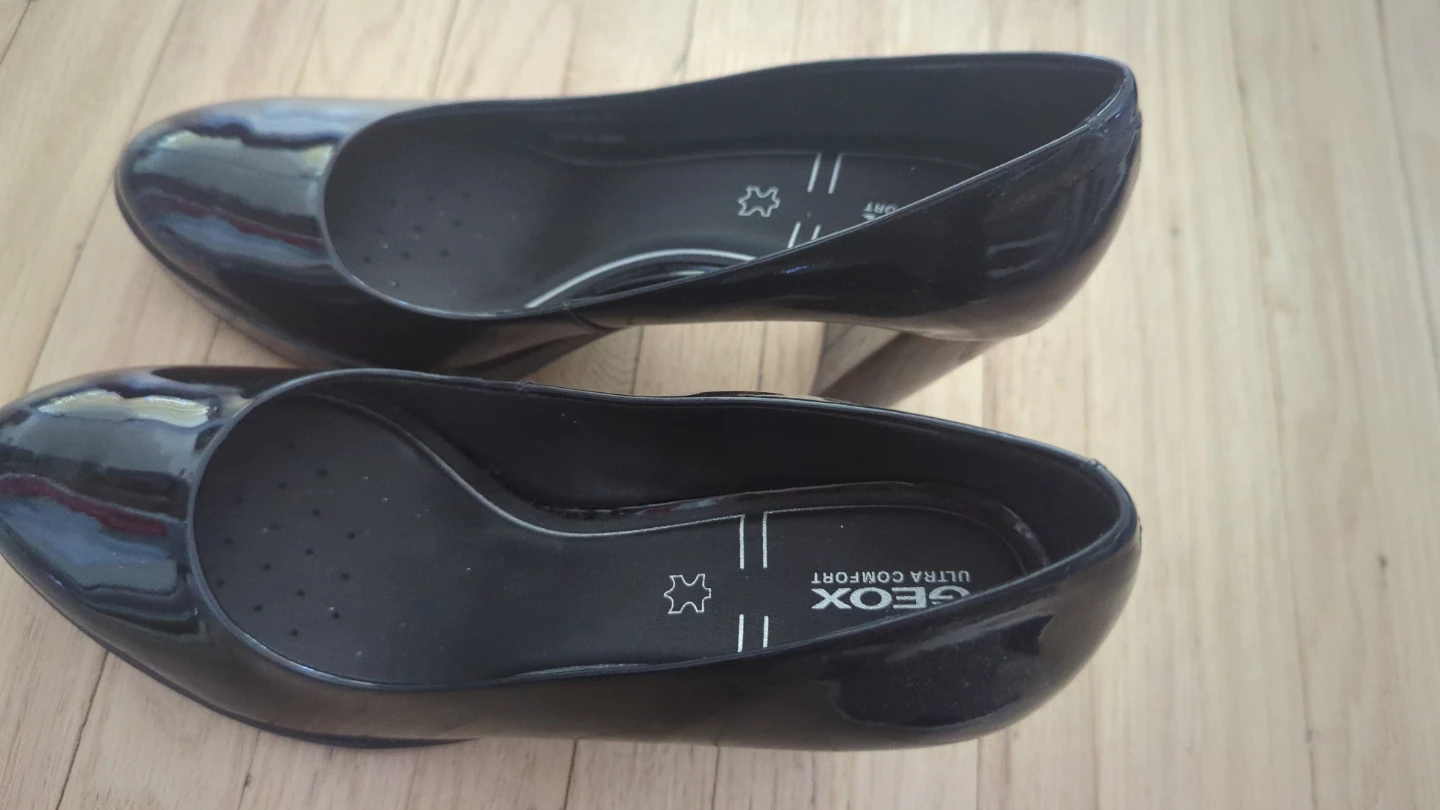 Black patent leather heels by Geox