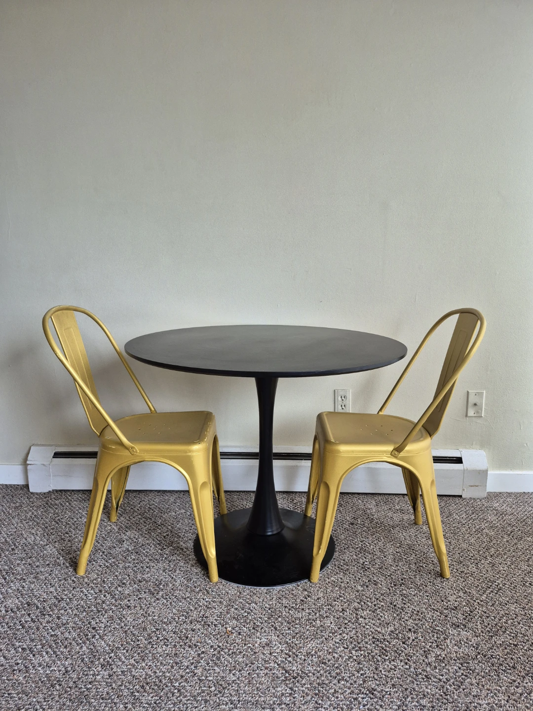 Round Black Table with 2 Yellow Metal Chairs