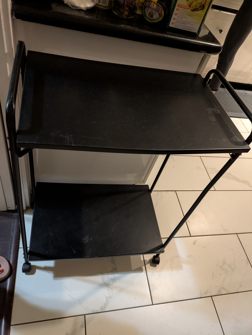 🏆 Metal shelving unit on wheels.