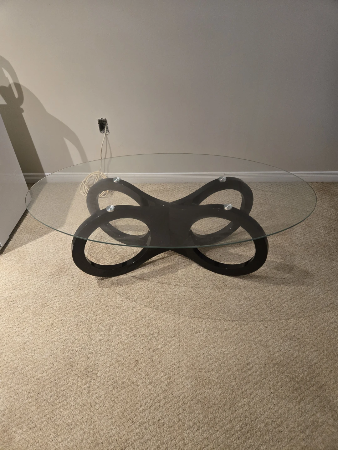 Glass Top Coffee Table with Black Infinity Base