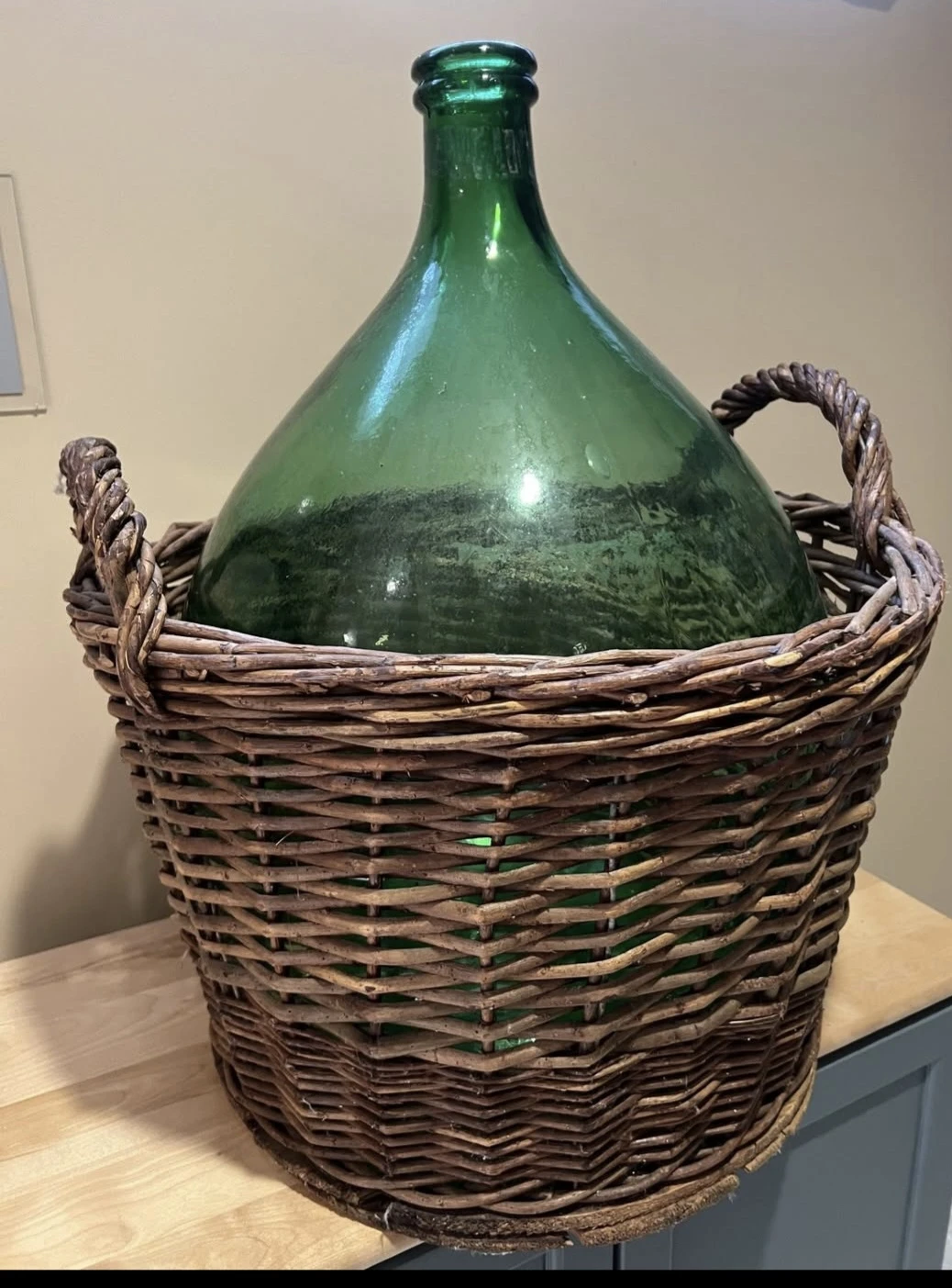 Large Green Glass Demijohn Bottle in Wicker Basket