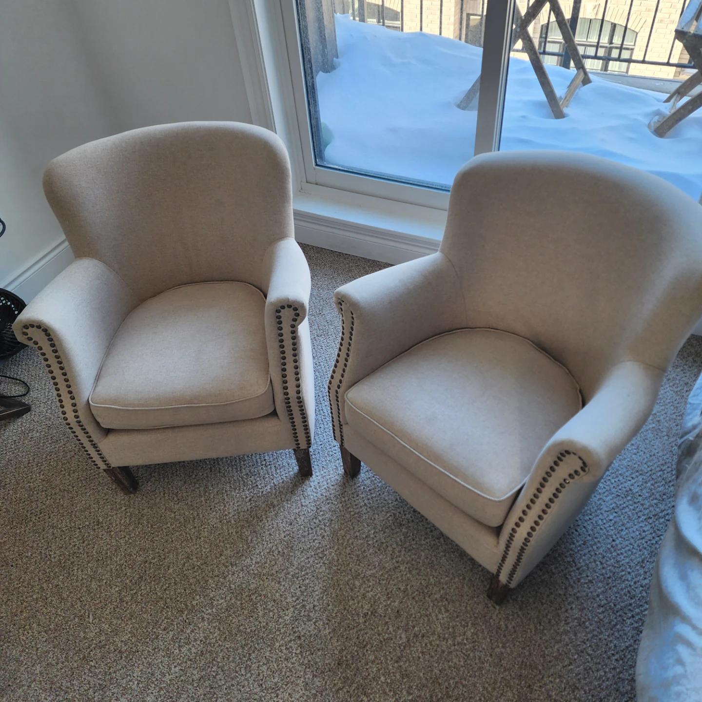 A pair of Beige Upholstered Accent Chair with Nailhead Trim