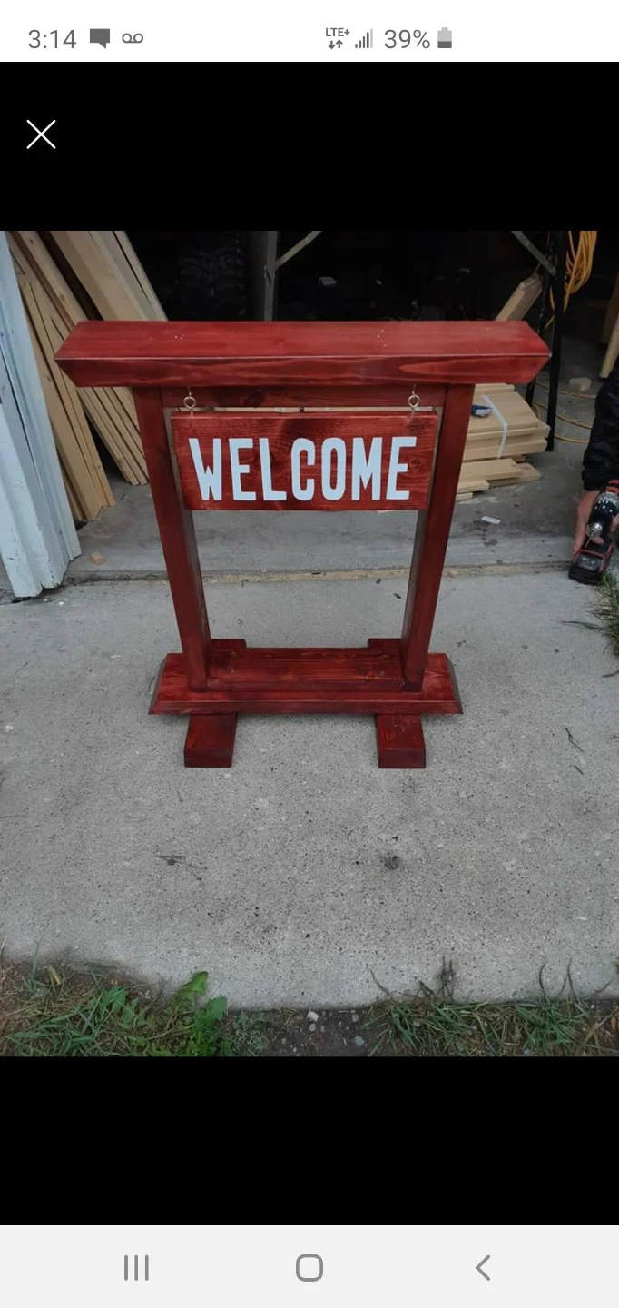 Wooden Welcome Sign hang a plant on it