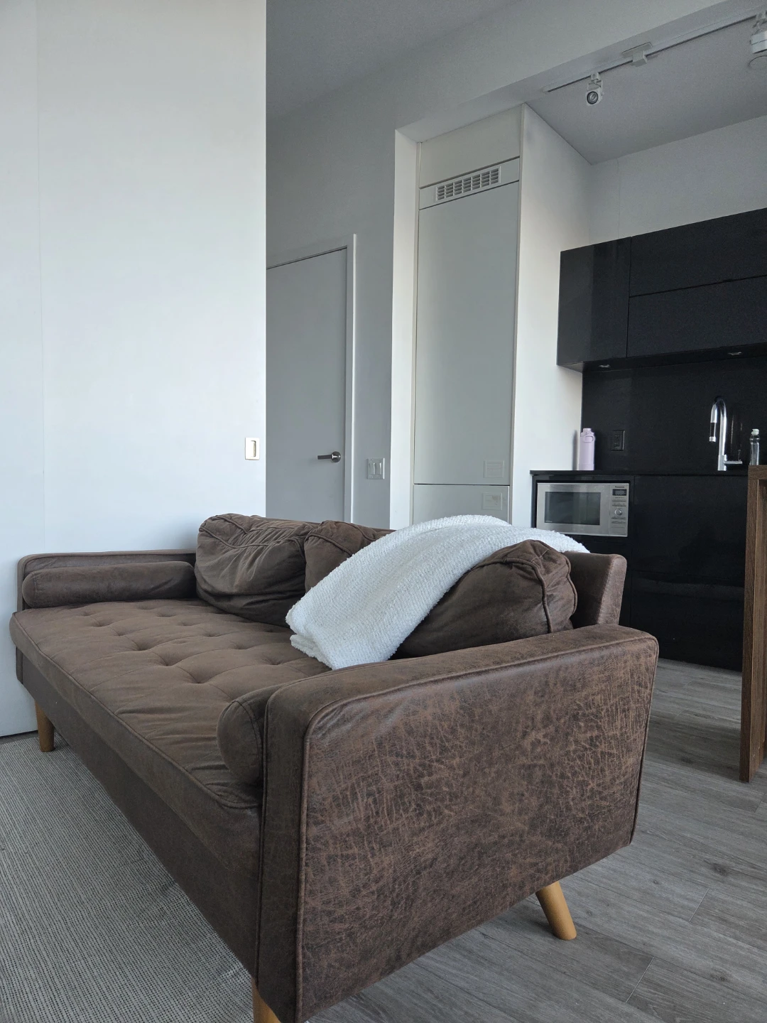 Brown Tufted Sofa